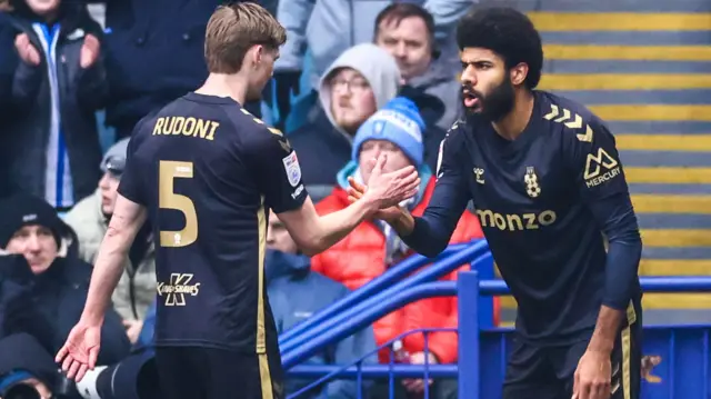 Ellis Simms celebrates scoring