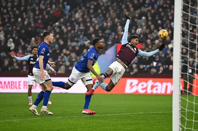 Marcus Rashford of Aston Villa is fouled by Ben Johnson