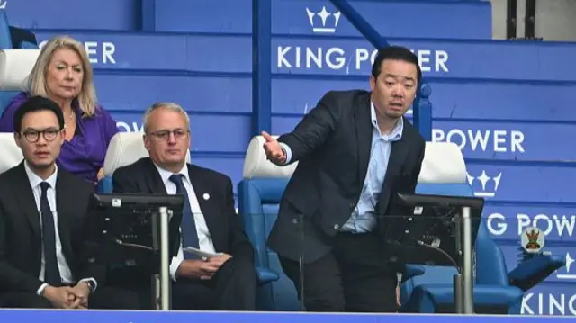 John Rudkin, Leicester City director of football and Aiyawatt Srivaddhanaprabha, Leicester Chairman react