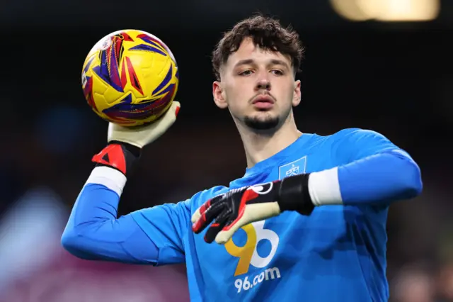 Burnley goalkeeper James Trafford holding the ball