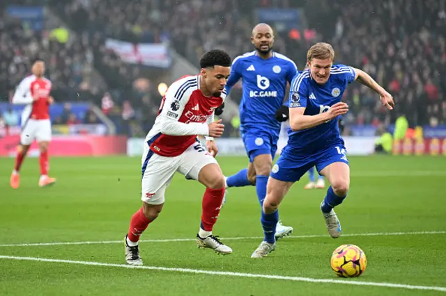 Ethan Nwaneri of Arsenal battles for possession with Victor Kristiansen