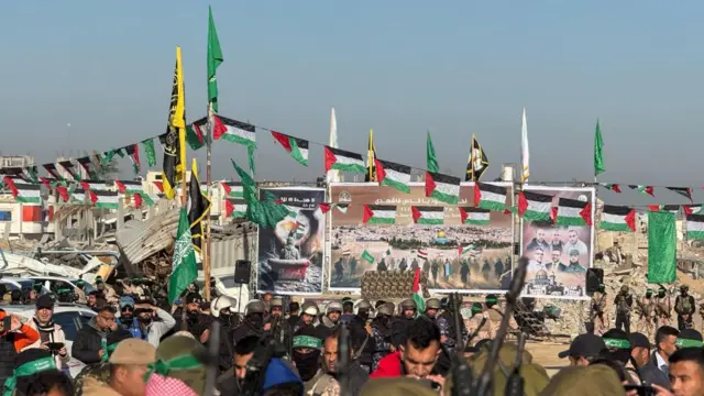 A stage set up in Khan Yunis in Gaza. There are many Palestinian flags and images of Hamas leaders