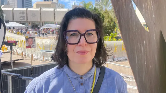 Sharone Lifschitz looks to camera as she has her photo taken in Israel