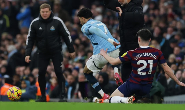 Manchester City's Omar Marmoush in action with Newcastle United's Tino Livramento