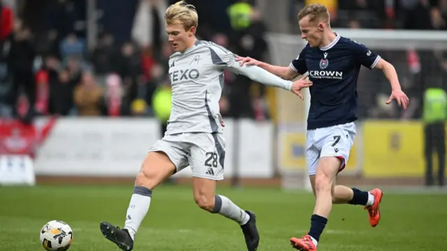 Aberdeen's Alexander Jensen and Dundee's Scott Tiffoney