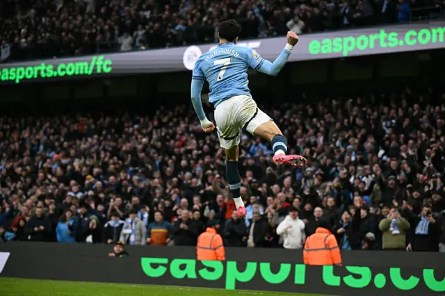 Omar Marmoush celebrates