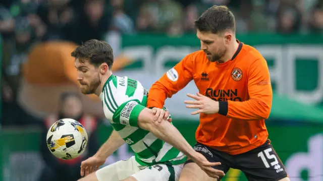 Celtic's Anthony Ralston holds off Dundee United's Glenn Middleton