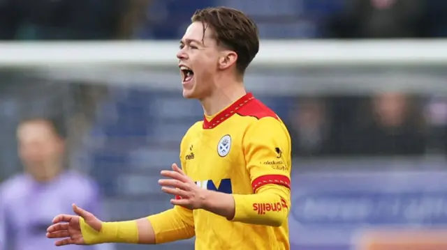 Ayr's Jay Henderson celebrates after scoring against Falkirk