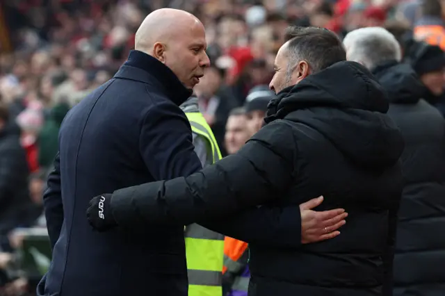 Arne Slot (L) greets Wolverhampton Wanderers' Portuguese head coach Vitor Pereira