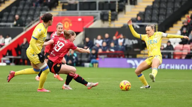 Elisabeth Terland of Manchester United scores