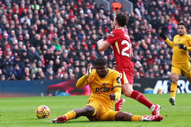 Diogo Jota of Liverpool wins a penalty from Emmanuel Agbadou