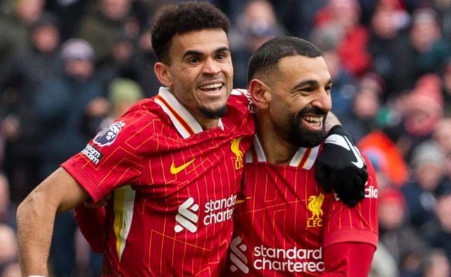 Luis Diaz of Liverpool (L) celebrates with Mohamed Salah after scoring