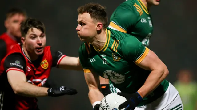 Down's Peter Fegan attempts to halt Meath's Ronan Jones