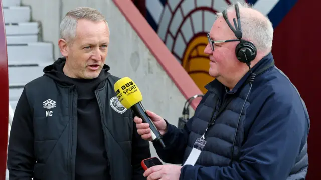 Hearts head coach Neil Critchley with BBC Scotland's Brian McLauchlin