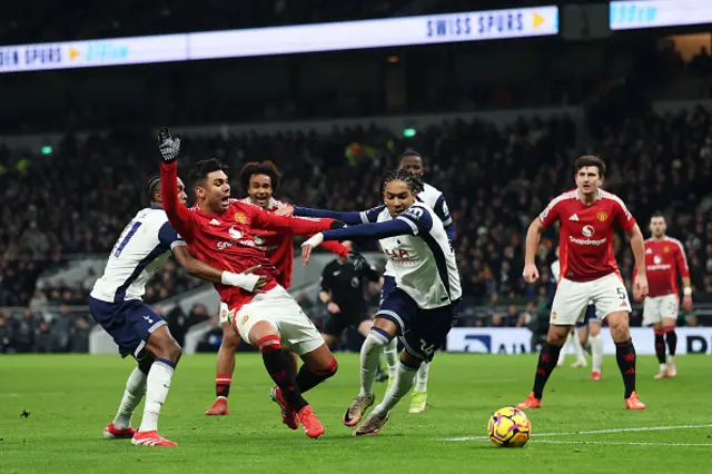 Casemiro of Manchester United is challenged by Mathys Tel and Djed Spence