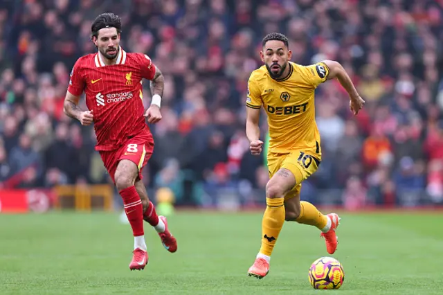 Dominik Szoboszklai of Liverpool and Matheus Cunha in action