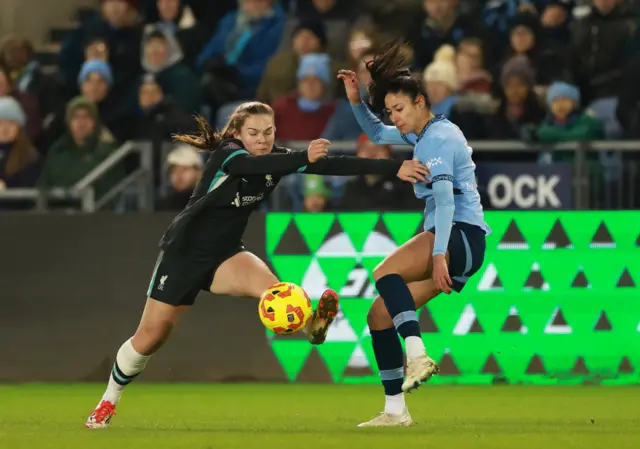 Liverpool's Lucy Parry in action with Manchester City's Leila Ouhab