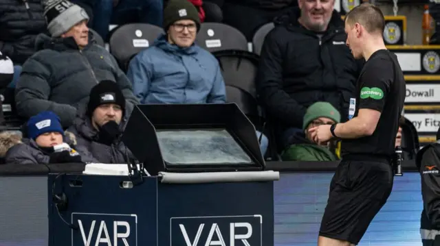 Referee Ross Hardie overturned his initial penalty award after consulting the pitchside monitor