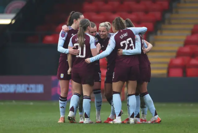 Aston Villa women players celebrate a goal v Brighton