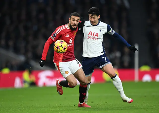 Noussair Mazraoui of Manchester United looks to control the ball