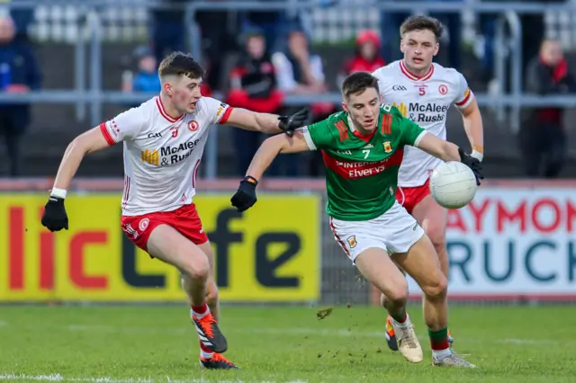 Tyrone's Ciaran Daly attempts to keep pace with Mayo's Enda Hession in last year's Division One clash at Healy Park