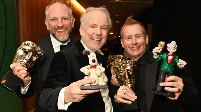 (L to R) Richard Beek, Nick Park and Merlin Crossingham, winner of Best Animated Film for "Wallace and Gromit: Vengeance Most Fowl", pose backstage during the EE BAFTA Film Awards 2025 at The Royal Festival Hall on February 16, 2025 in London, England.