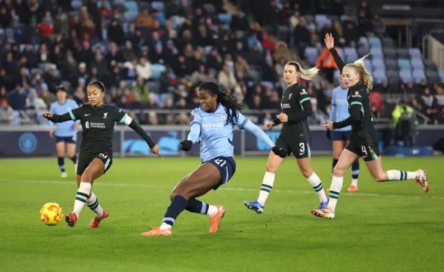 Khadija Shaw of Manchester City scores her team's first goal.