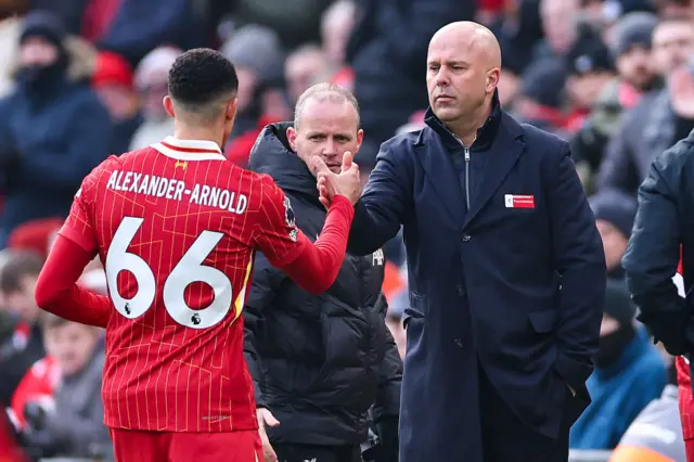 Arne Slot embraces Trent Alexander-Arnold