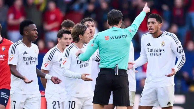 : Jude Bellingham of Real Madrid receives a red card form referee Jose Luis Munuera Montero and is sent off