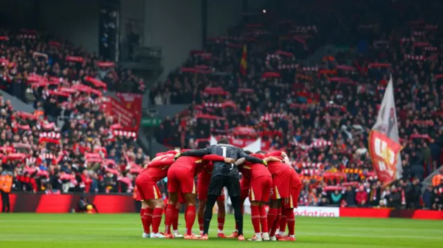 Liverpool huddle together ahead of the Premier League match between Liverpool FC and