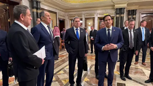 Russian and US delegations in a lobby in Diriyah Palace Saudi Arabia