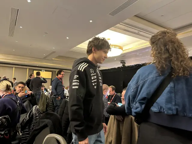 Andrea Kimi Antonelli walks through the media centre at F1 75