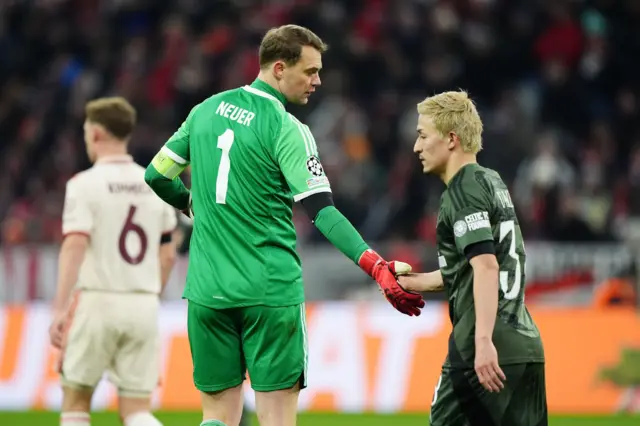 Neuer and Maeda shake hands