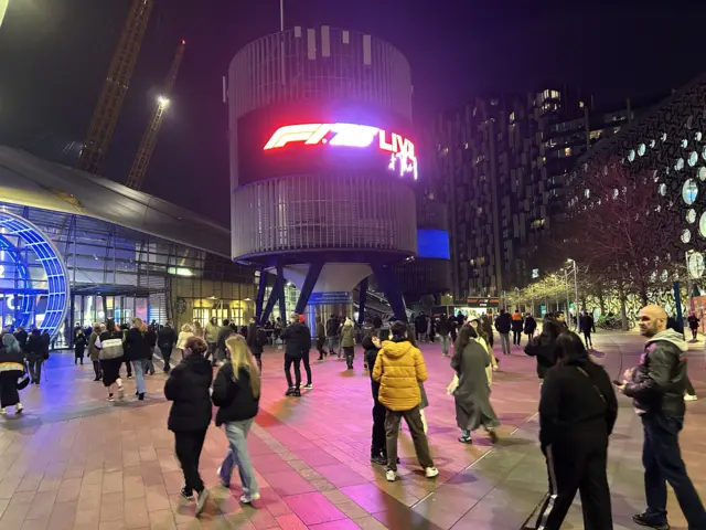 A sign for F1 75b lit up at the O2 Arena