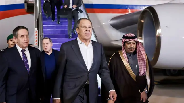 A handout photo made available by the Russian Foreign ministry press service shows Russian Foreign Minister Sergey Lavrov (C) and Russian presidential aide Yury Ushakov