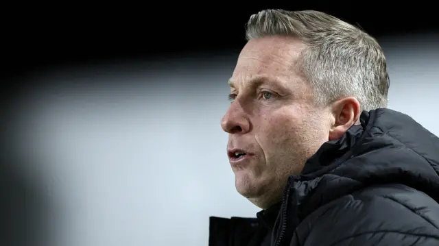 Neil Harris looks on