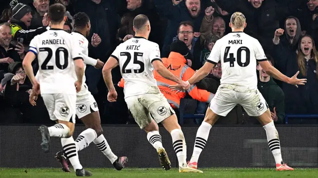 Plymouth players celebrate