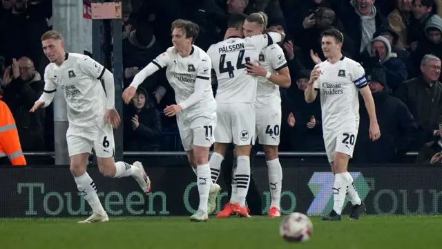 Plymouth players celebrate