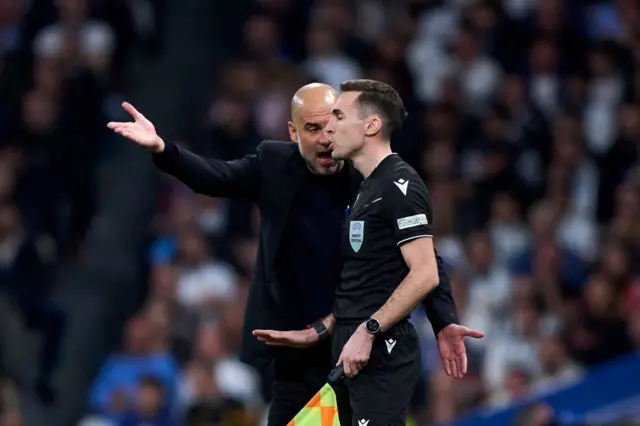 Head coach Pep Guardiola of Manchester City reacts with a referee