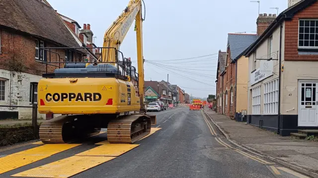 A digger on the scene in Godstone