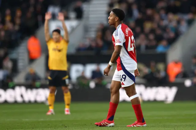 Myles Lewis-Skelly is upset after being sent off against Wolves