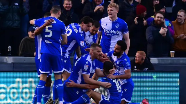 Bristol Rovers players celebrate third goal