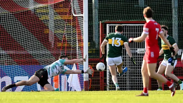 Conor Geaney strokes in Kerry's early goal past Derry goalkeeper Neil McNicholl