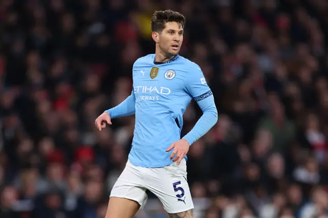 John Stones looks on