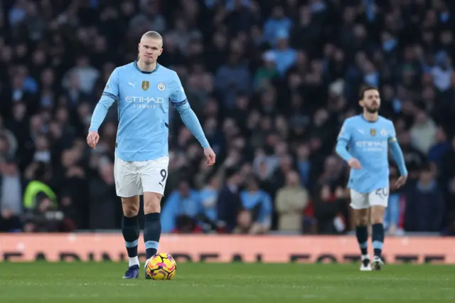 Erling Haaland of Manchester City looks dejected.