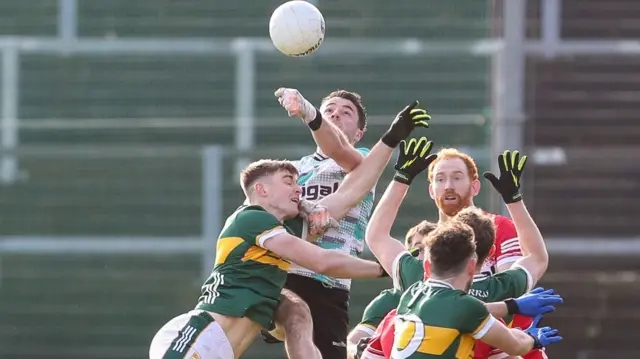 A battle for the high ball in the Celtic Park encounter