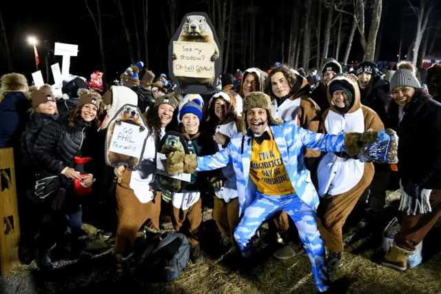 People pose with Groundhog Club’s Inner Circle Vice President Dan McGinley