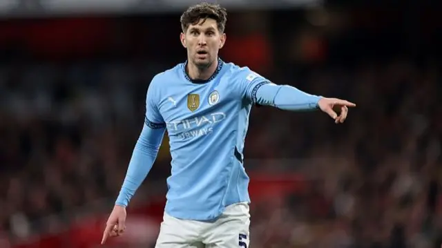 John Stones of Manchester City looks on