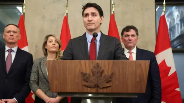Canada's Prime Minister Justin Trudeau is joined by Finance Minister Dominic LeBlanc, Minister of Foreign Affairs Melanie Joly, and Minister of Public Safety David McGuinty, as he speaks during a press conference while responding to U.S. President Donald Trump's orders to impose 25% tariffs on Canadian imports, in Ottawa, Ontario, Canada February 1, 2025.