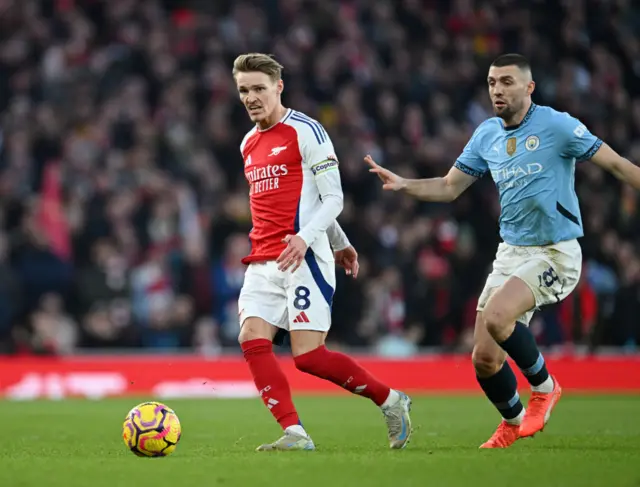 Martin Odegaard of Arsenal runs with the ball